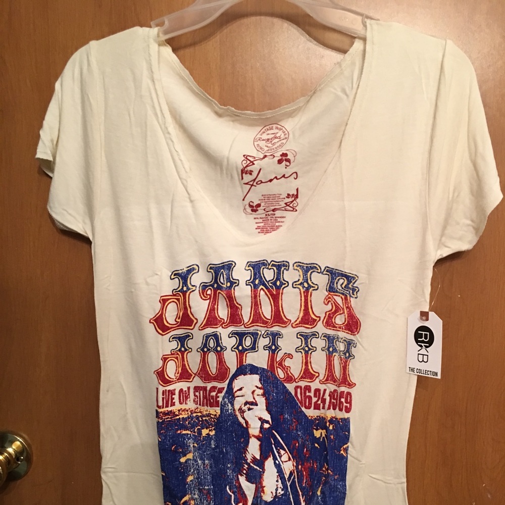 T- with Janis Joplin on it. Size small